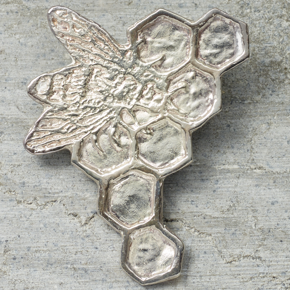 Satin finished sterling silver bee pin by artist Kiki Smith