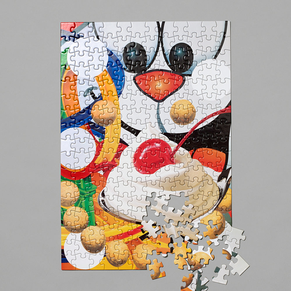 Jeff Koons Loopy jigsaw puzzle and pieces. Measures 16.5 x 11.5
