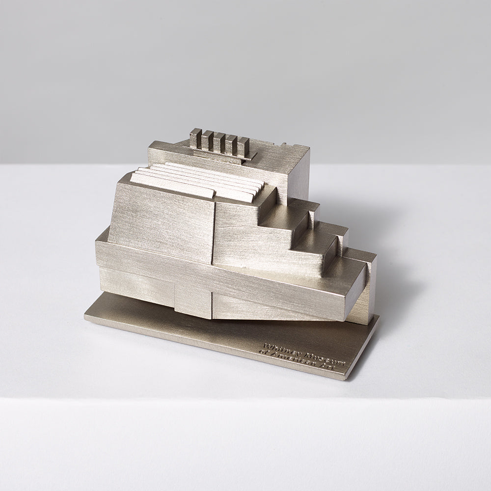 Solid cast pewter replica of the Whitney building. Measures 2.5" x 2.8"