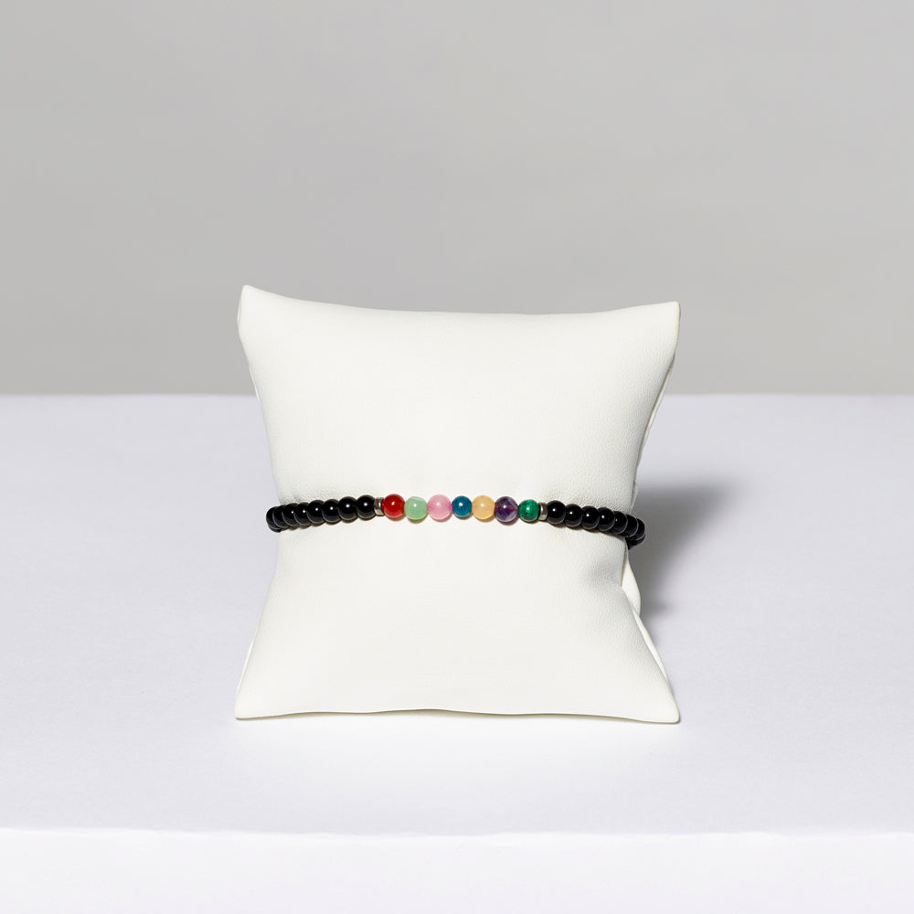 Black stretch bracelet with stone beads. Measures 7.5"