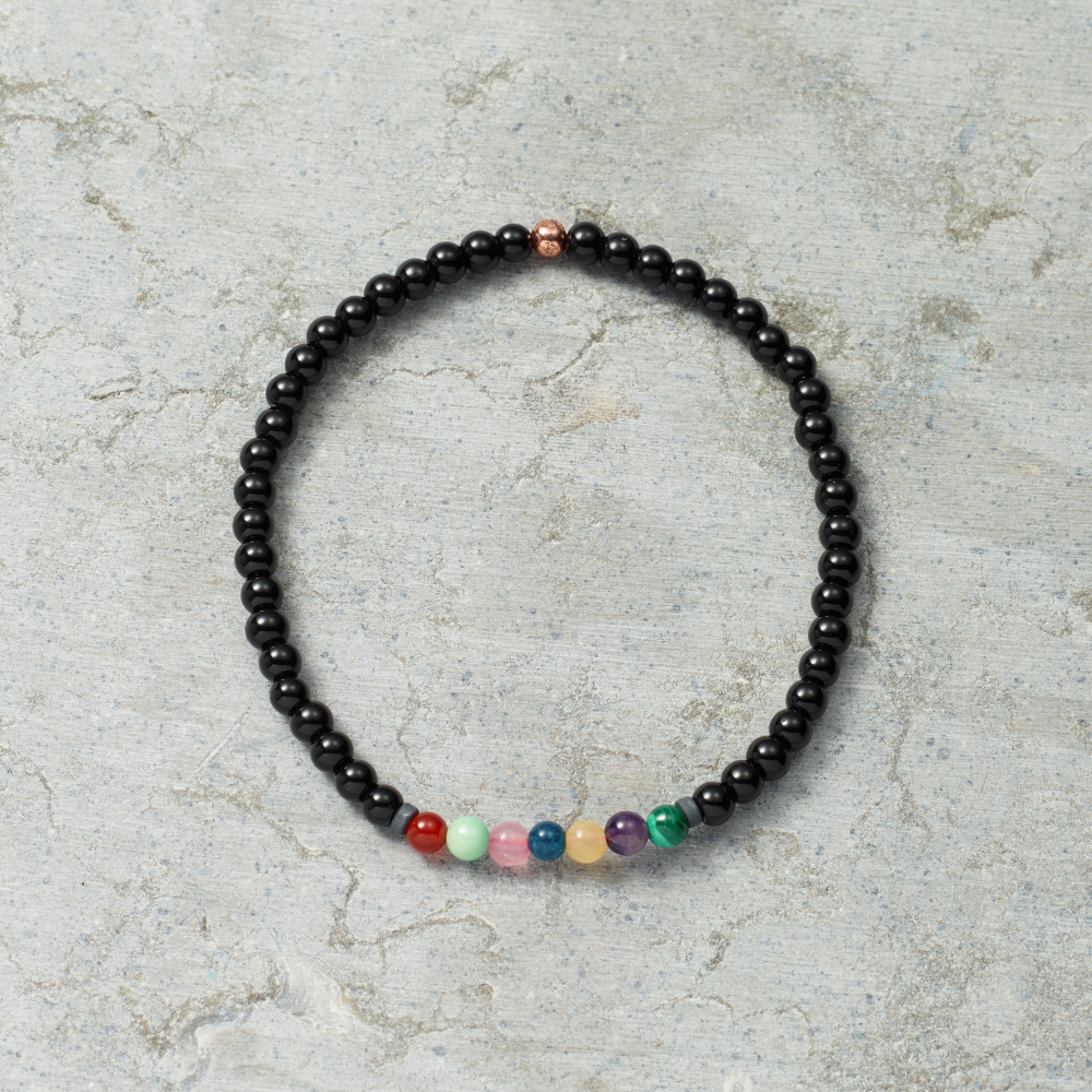 Black stretch bracelet with stone beads. Measures 7.5"