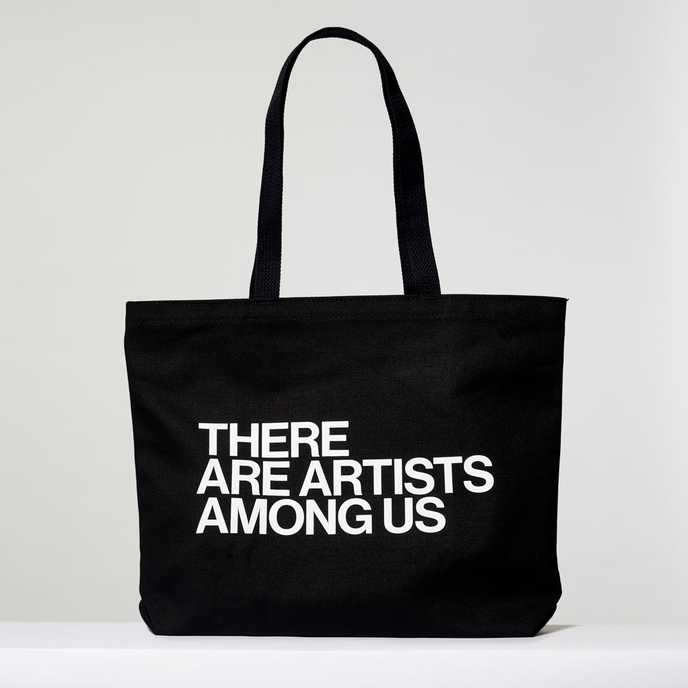 100% cotton black tote with There Are Artists Among Us text in white written across. Measures 18" x 14". 3.5" gusset, 11" handles.