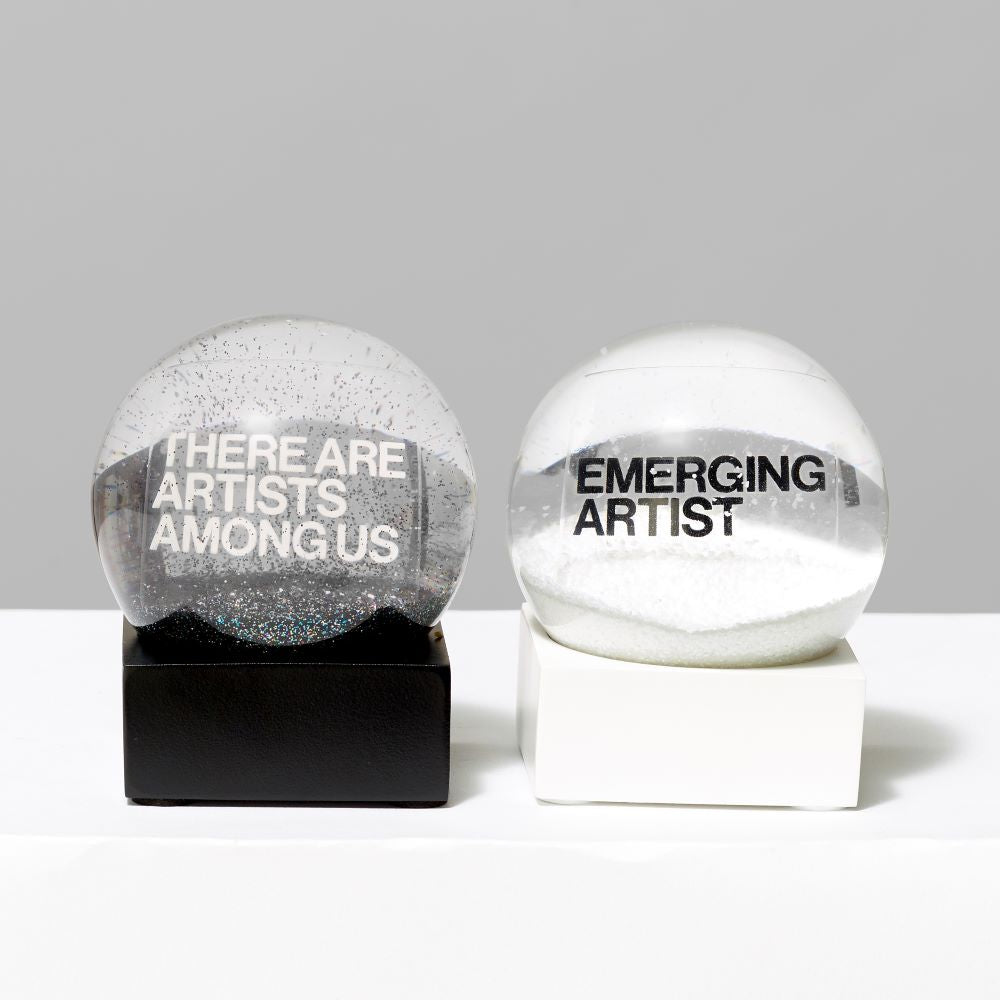 Two 3 Fl oz. and 2.56" Snow Globes featuring the text "There Are Artists Among Us" and "Emerging Artist"
