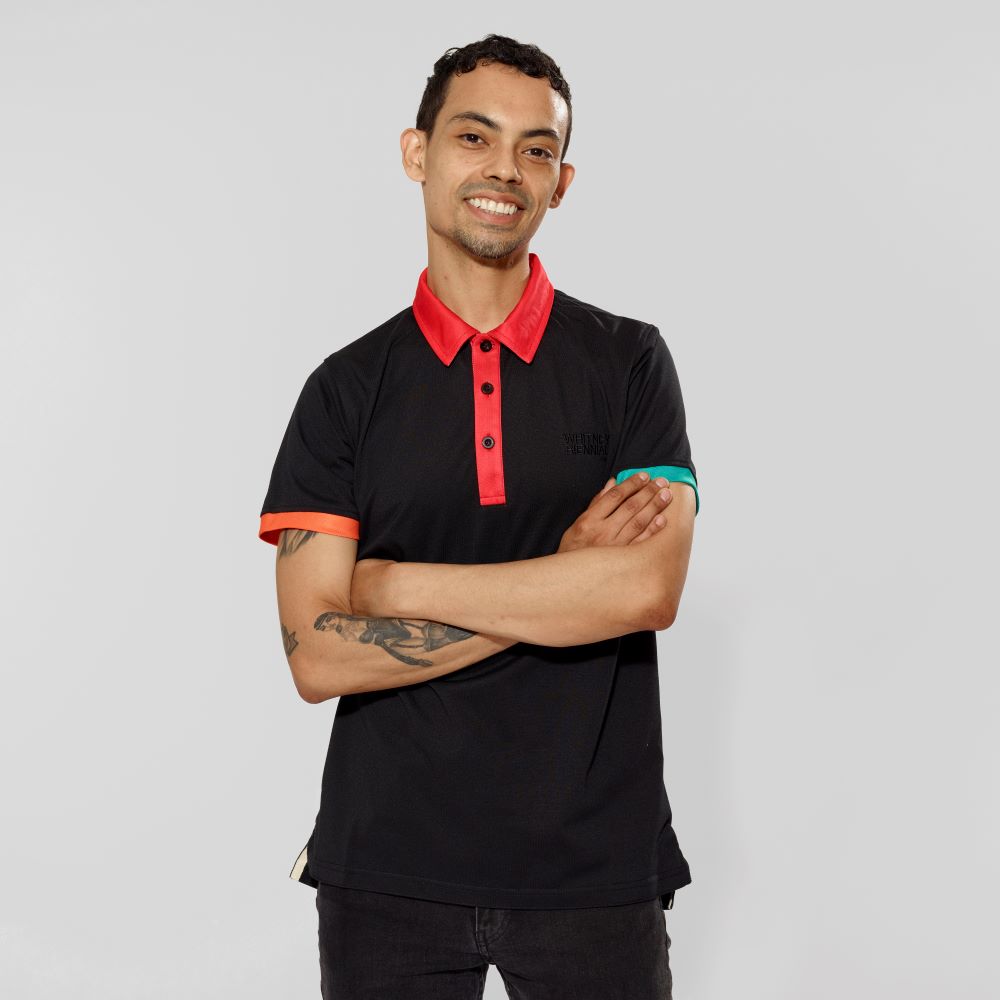 Model wearing 100% Polyester Microfiber Biennial Polo Shirt