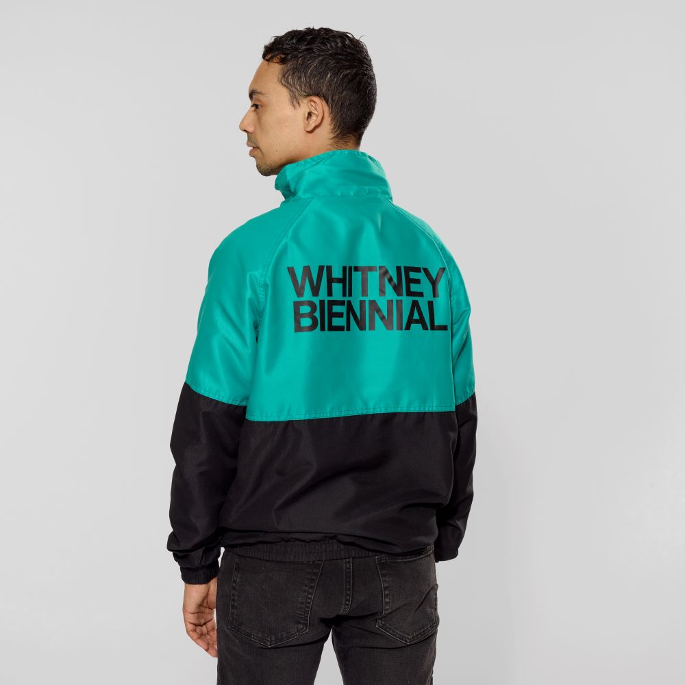 Model wearing 100% Polyester Microfiber Biennial Track Jacket