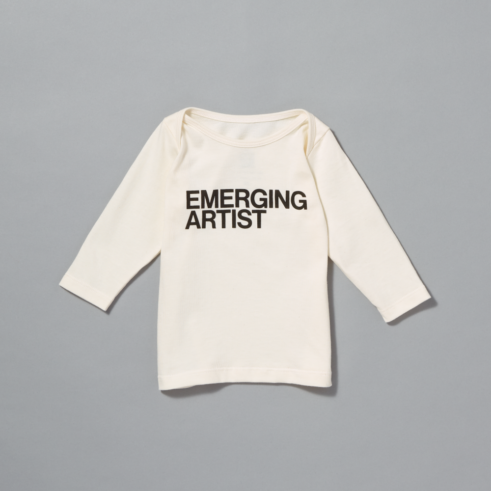 100% certified organic cotton white baby t-shirt with "Emerging Artist" written in black text on the front