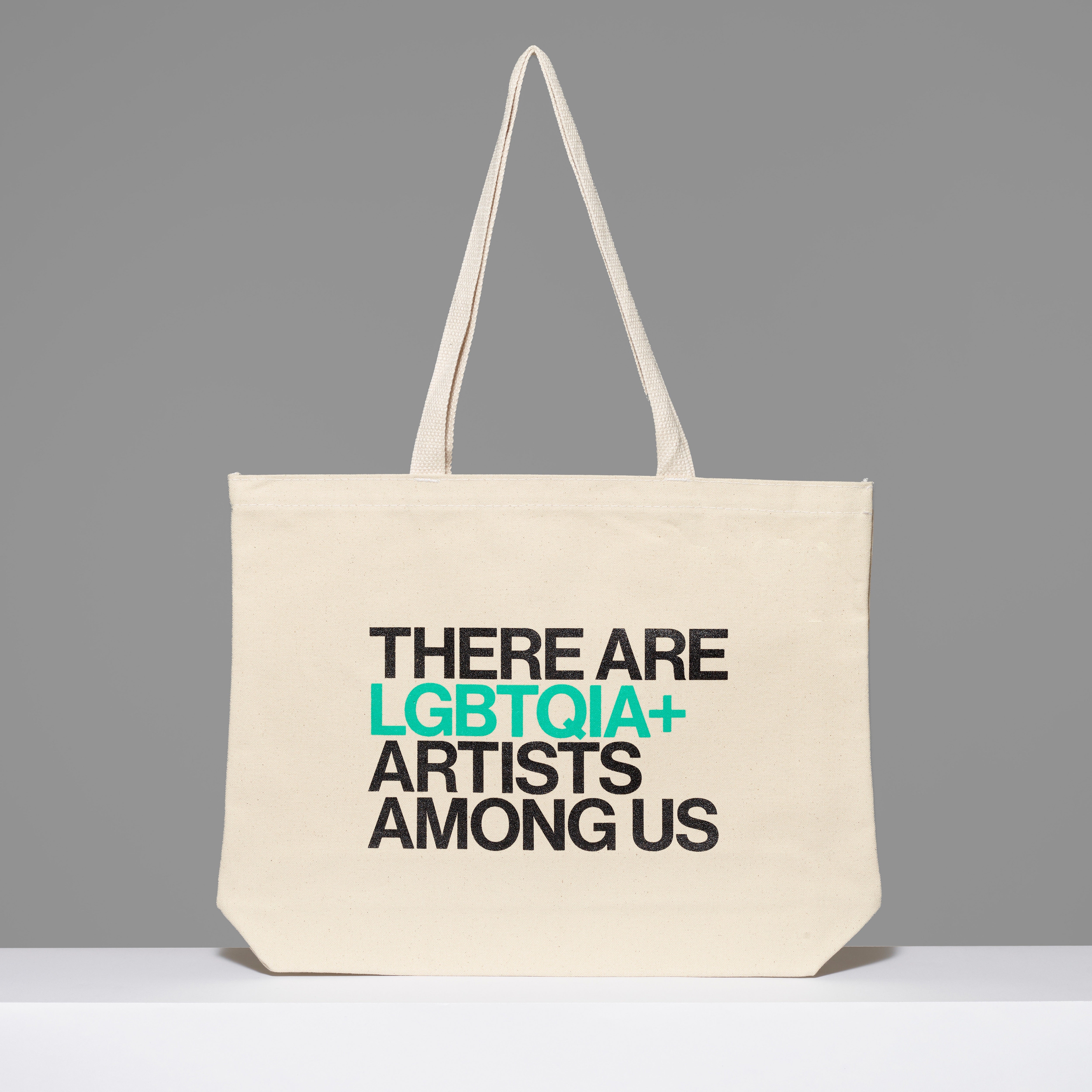 100% cotton There Are LGBTQIA+ Artists Among Us Tote with black and green text. Measures 18" x 14". 3.5" gusset, 11" handles.