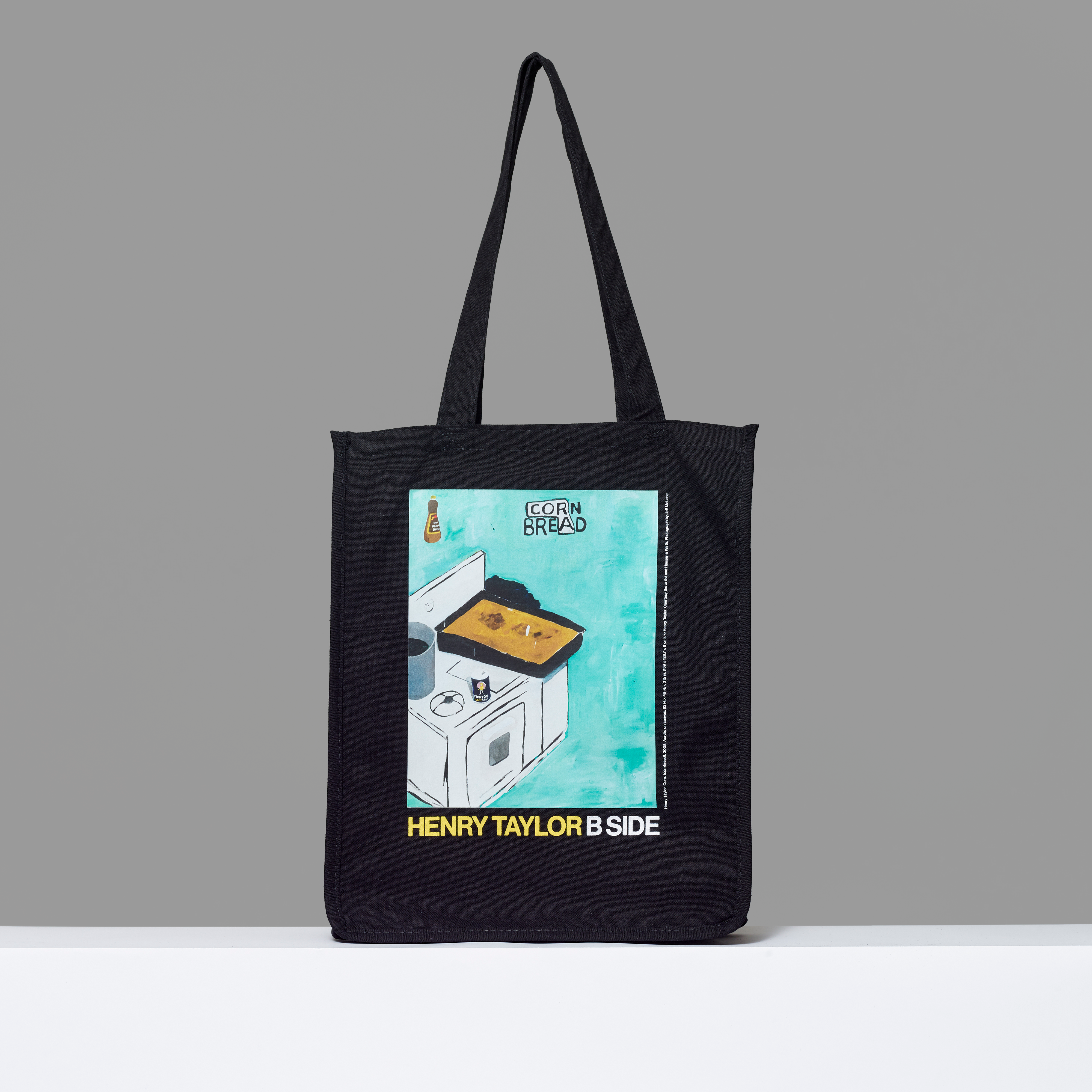 100% cotton black tote featuring Henry Taylor's Cora (cornbread). 15" H x 14.25" L x 5" W.