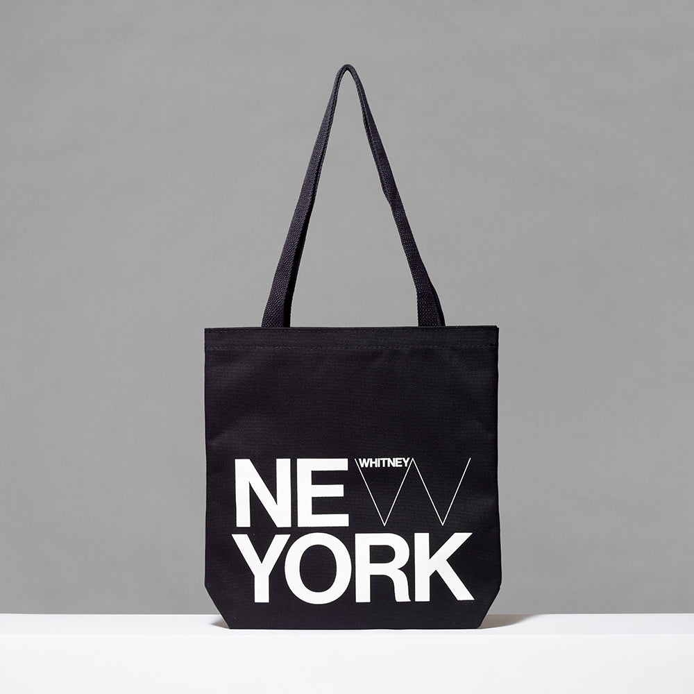 100% cotton black tote with New York and Whitney logo screen printed in white. Measures 13.5" x 13.75". 3.5" gusset, 12" handles