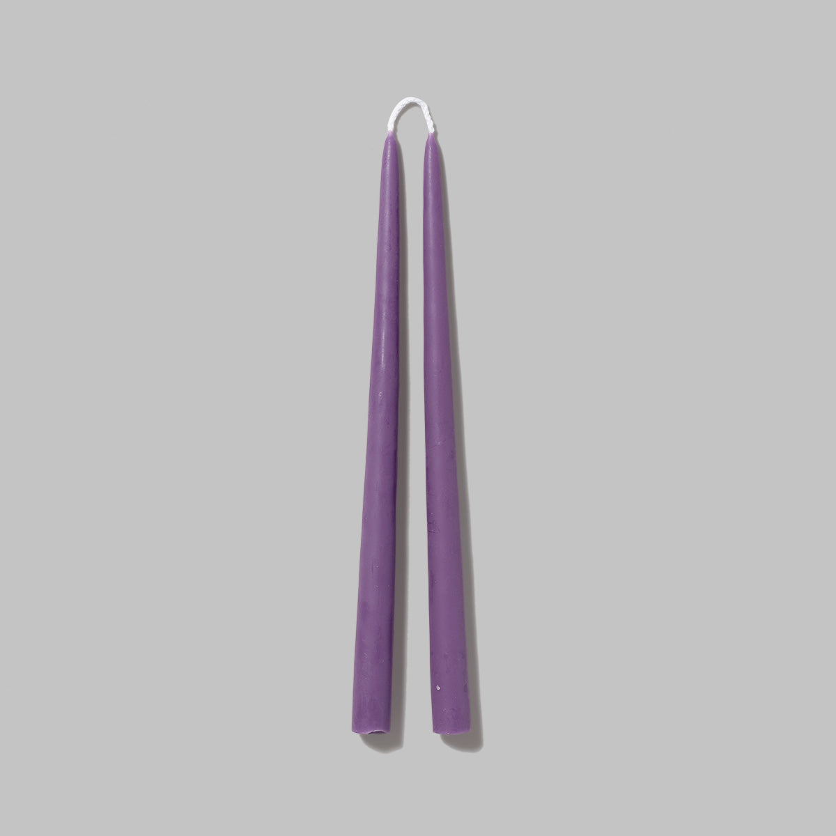 Set of lavender Beeswax pillar candles. Measures 0.8 in diameter x 11.5 in tall