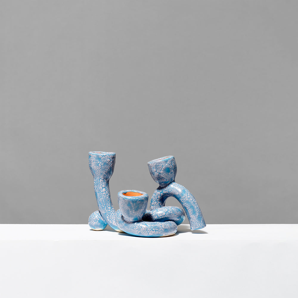 Hand built ceramic with glaze blue/purple textured triple taper. Measures 7.25" x 5"