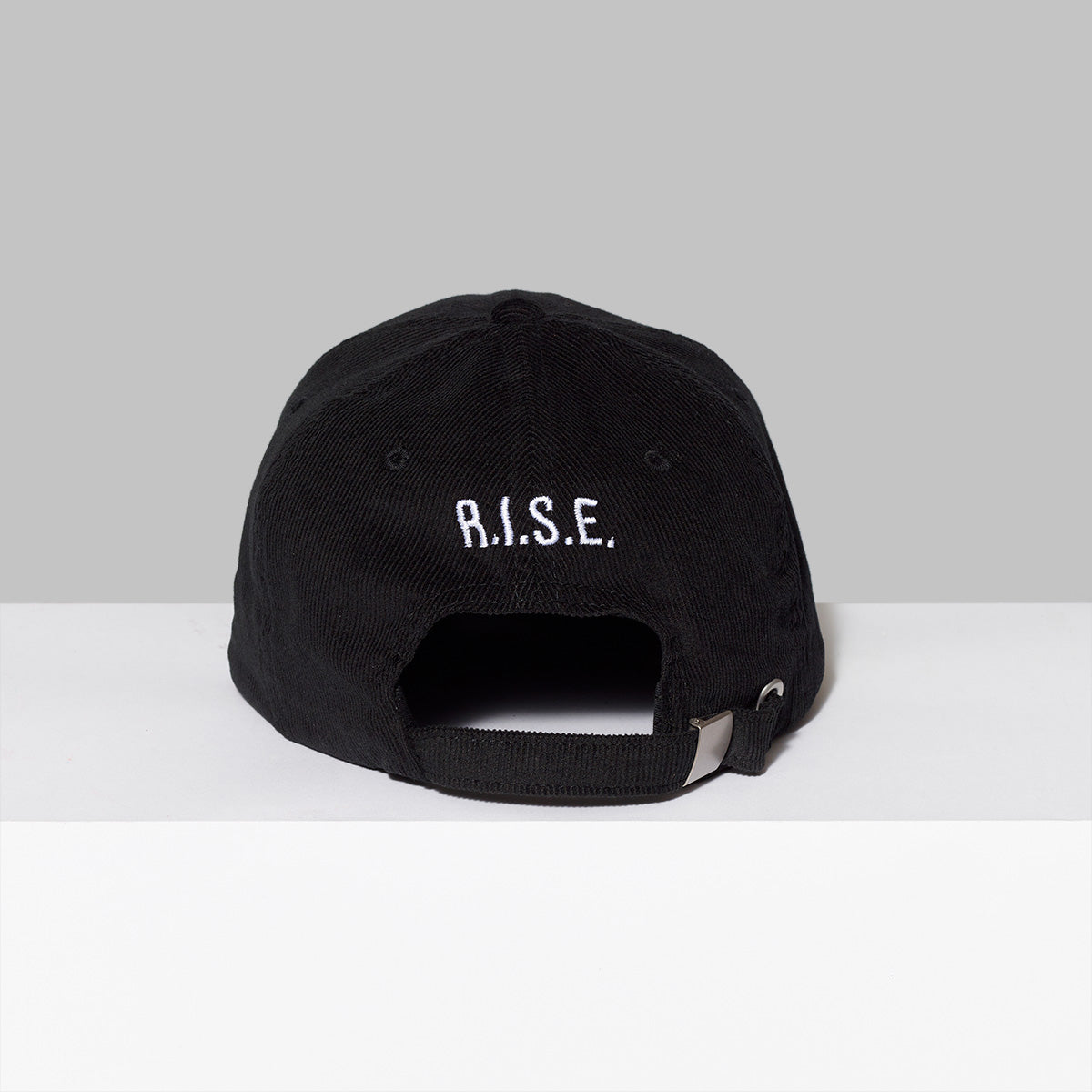 100% cotton corduroy black hat with R.I.S.E. embroidered in white