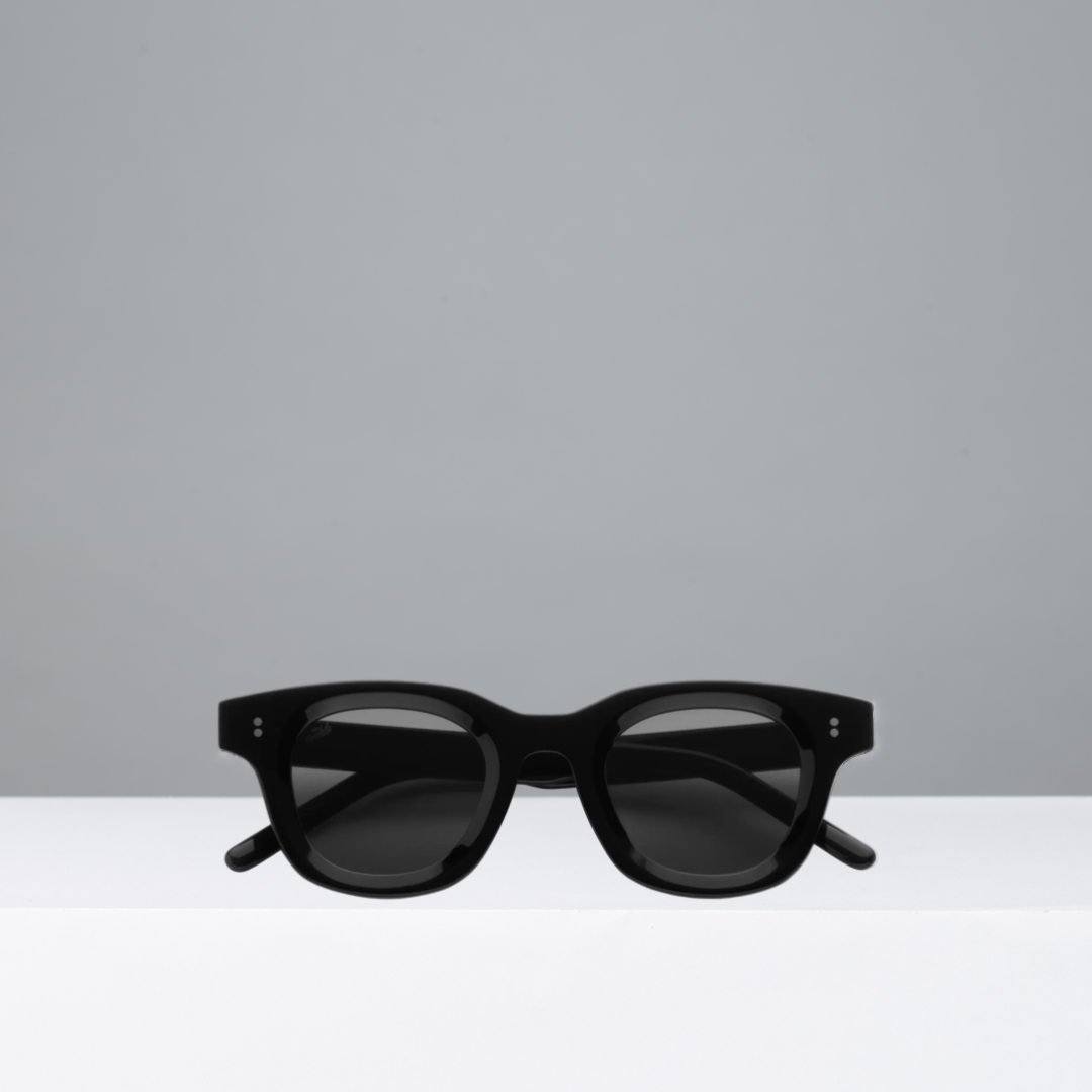 Black sunglasses on a light gray background