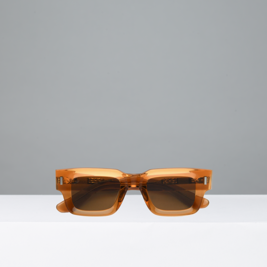 Brown sunglasses on a gray background