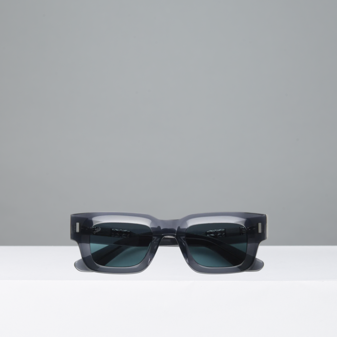 Sunglasses with dark lenses on a light gray background