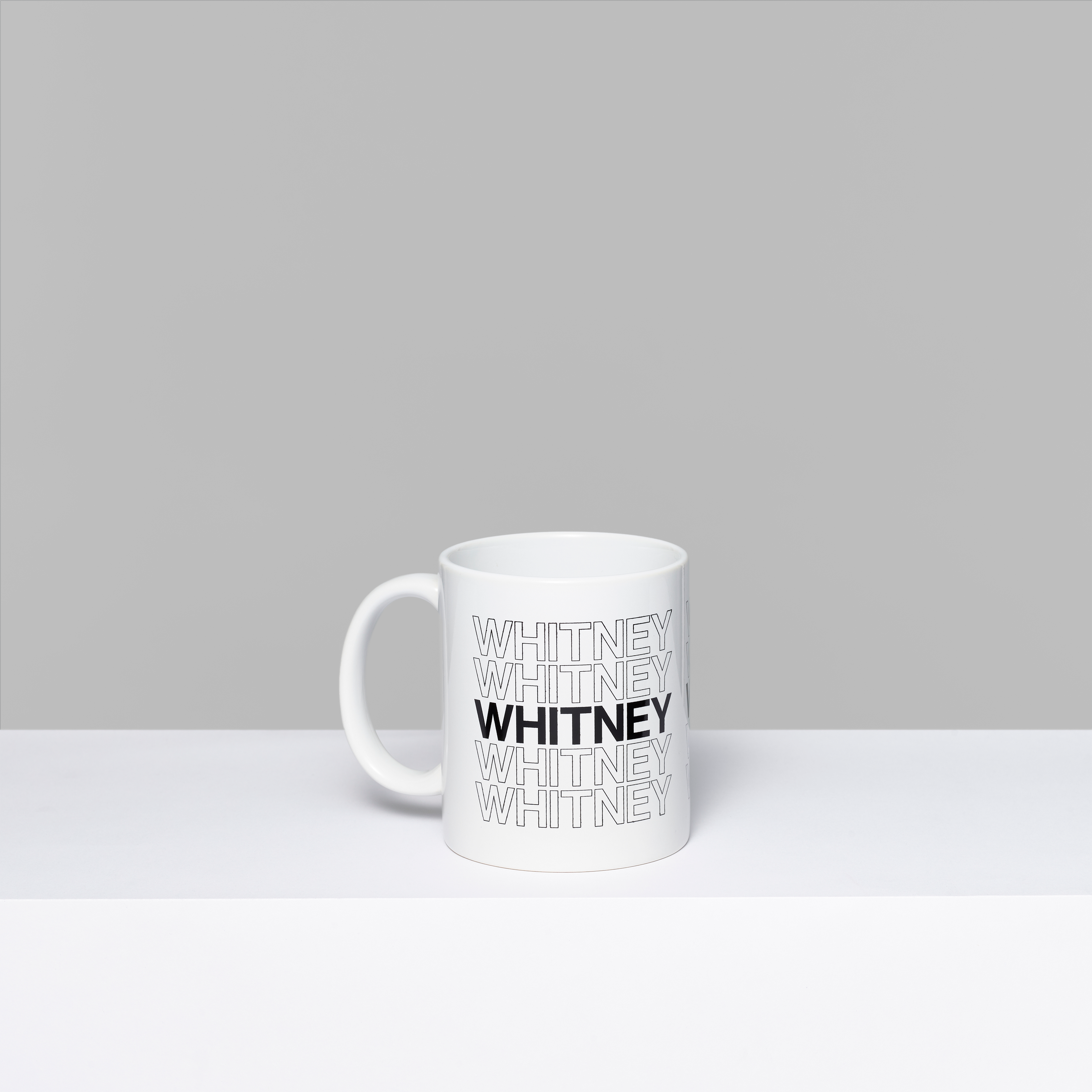 Whitney repeat white ceramic mug with Whitney in black text. Measures 3.75" x 3"