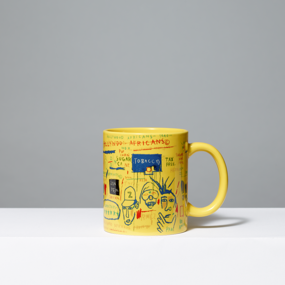 Yellow mug featuring Basquiat's Hollywood Africans on gray background