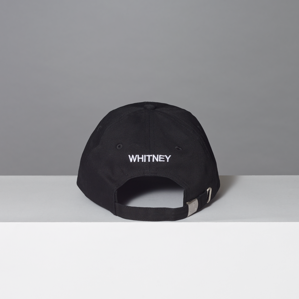 Back of 100% cotton twill black cap featuring Whitney embroidered in white thread.
