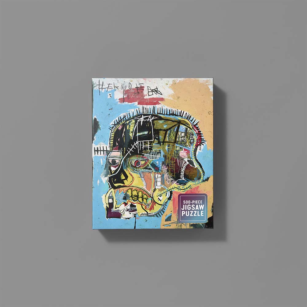 Jigsaw puzzle box featuring Jean-Michel Basquiat's Skull artwork
