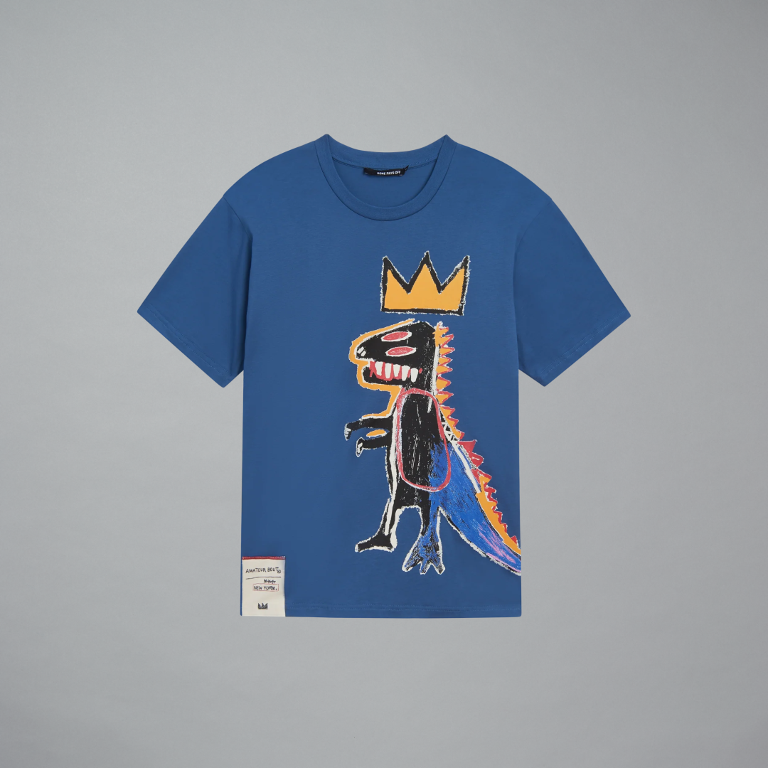 Blue t-shirt with a colorful graphic design of a dinosaur wearing a crown on a gray background