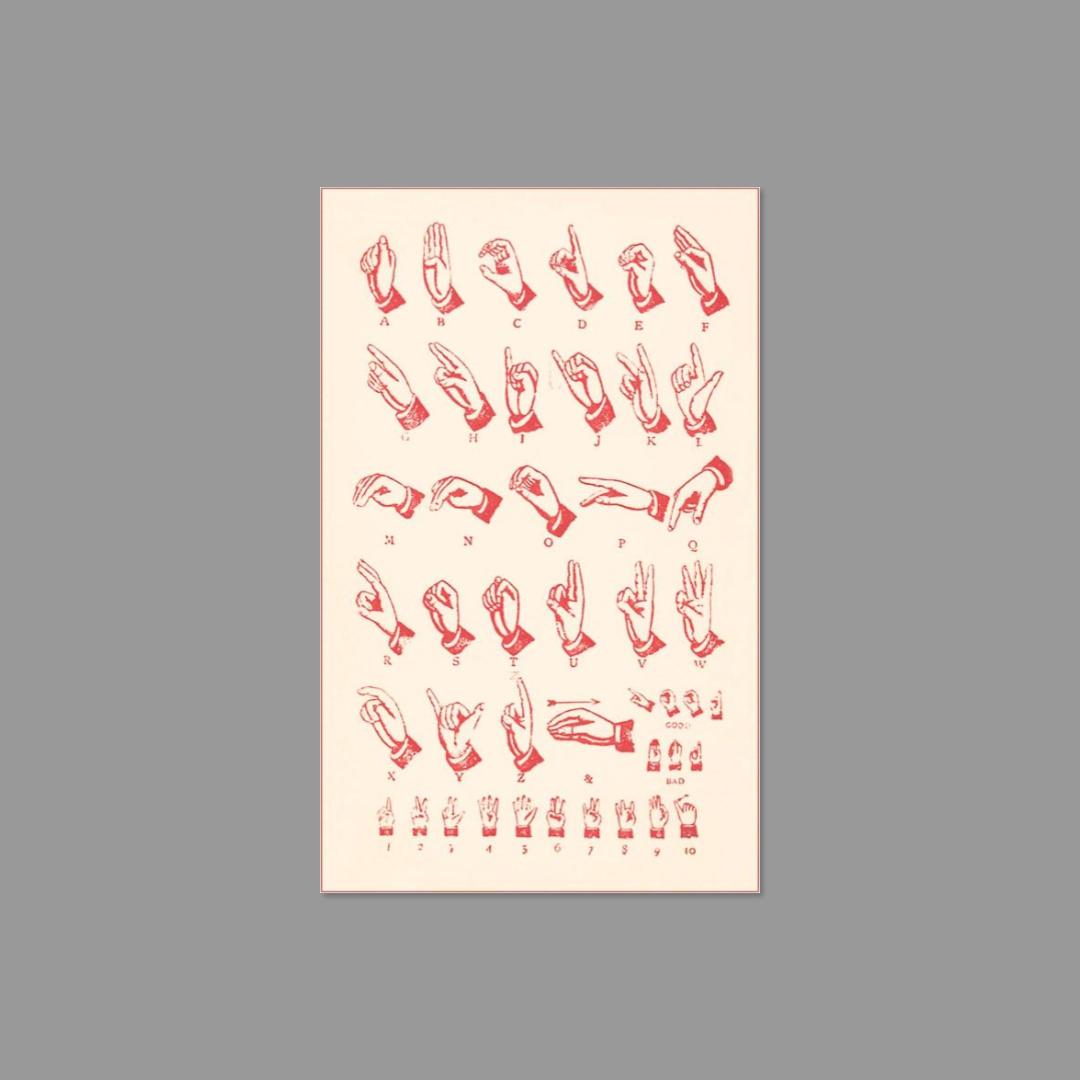 Sticker sheet of red alphabet and numbers in American Sign Language on a gray background