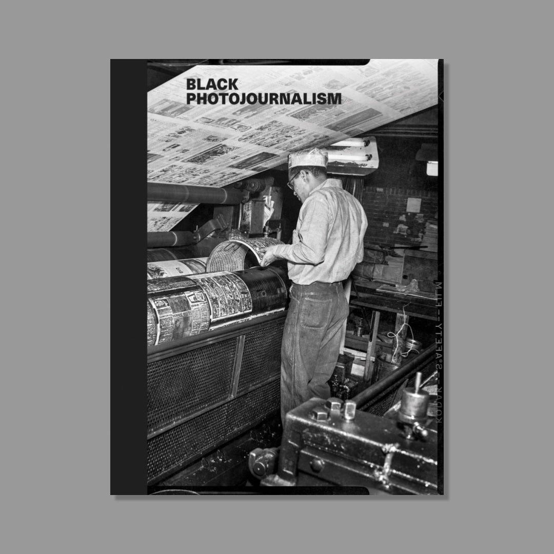 Book cover of 'Black Photojournalism' featuring a black and white photograph of a printer at work.