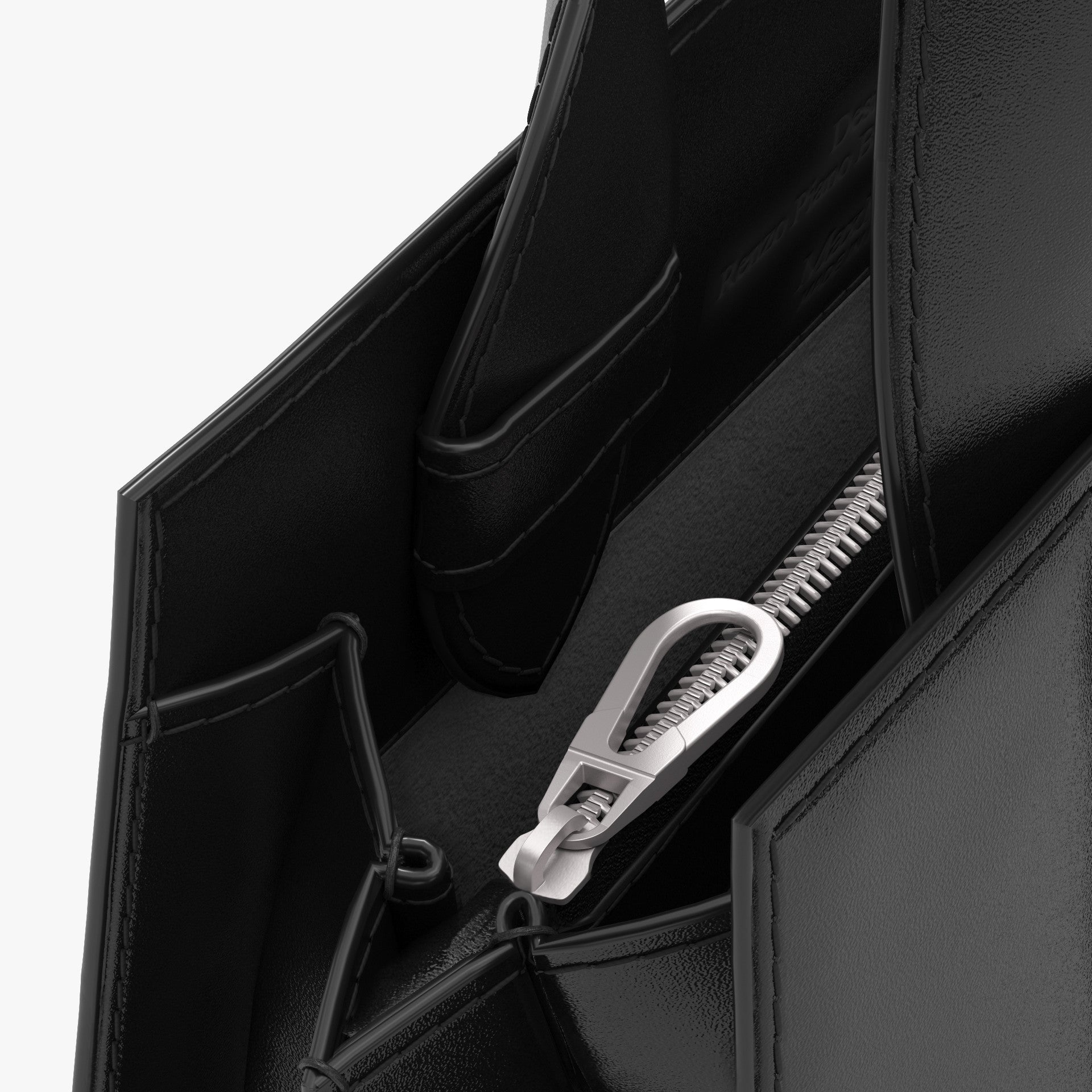 Close-up of a black bag with a silver zipper on a white background
