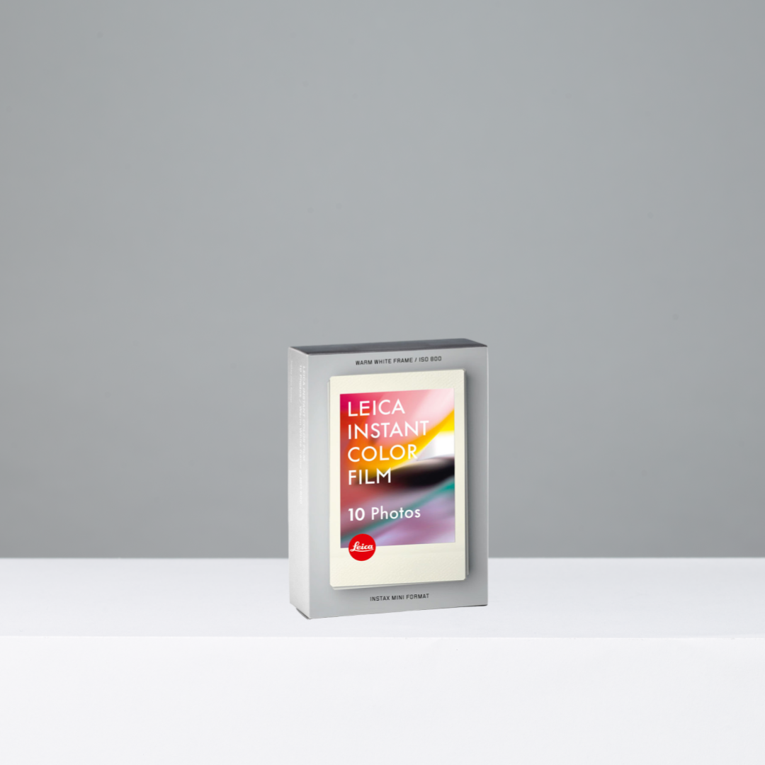 Leica Instant Color Film packaging on a gray background