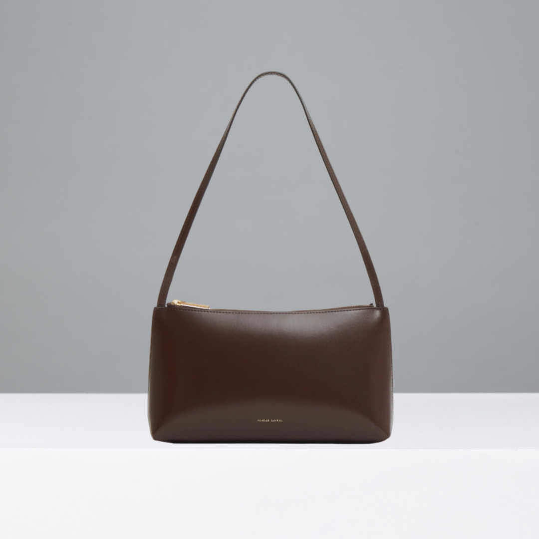 Brown handbag on a gray background