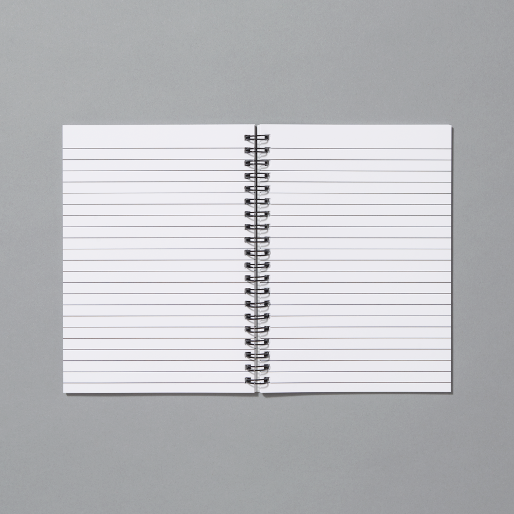 Open notebook with lined pages on a gray background