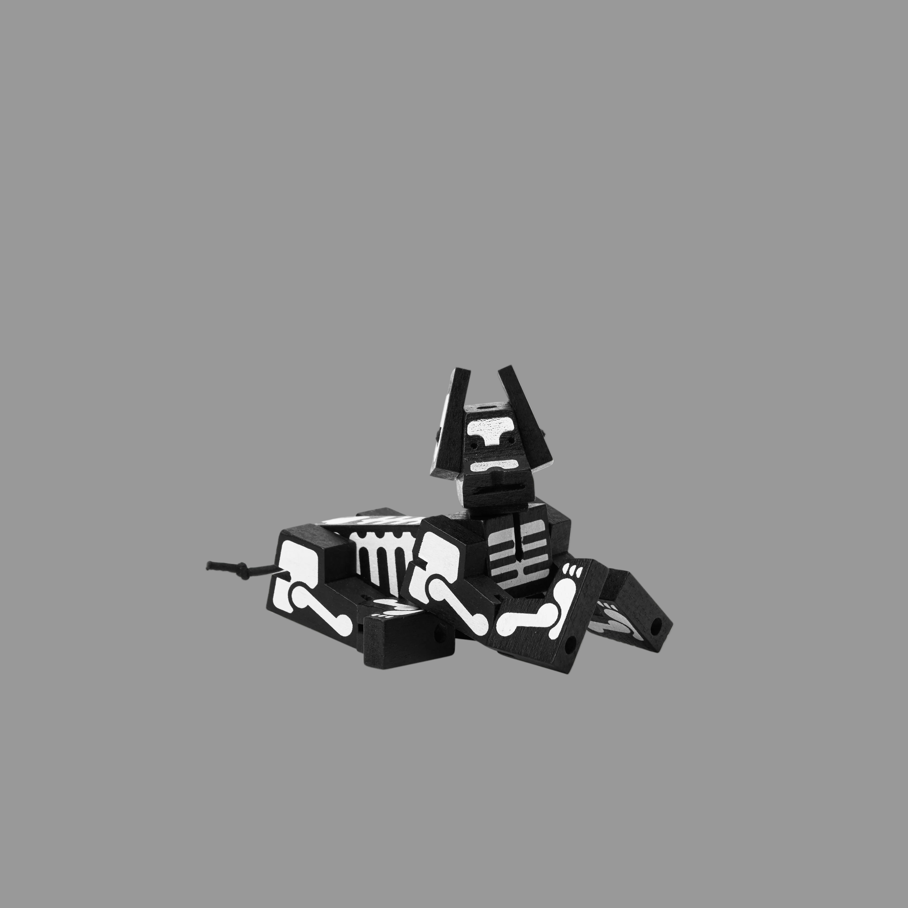 Black and white robotic dog on a grey background