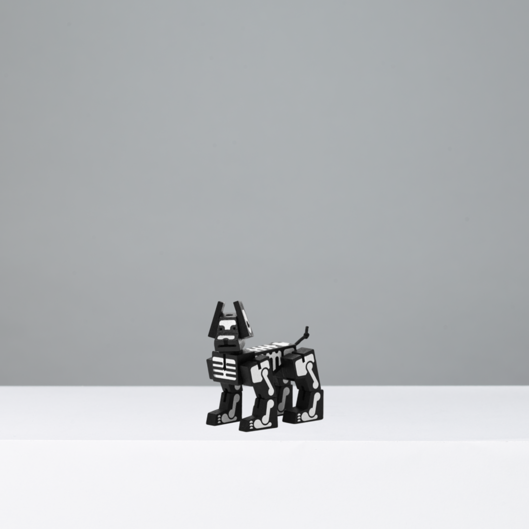 Black and white robotic dog on a grey background