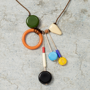 Necklace with colorful beads on a textured surface