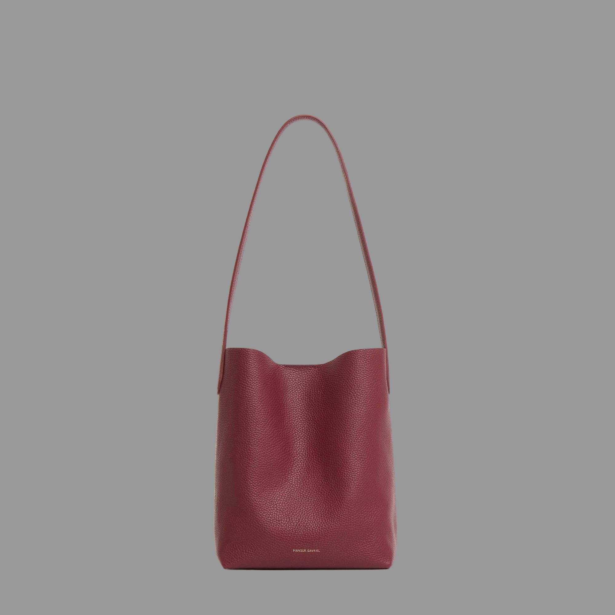 Oxblood red leather handbag on a light gray background