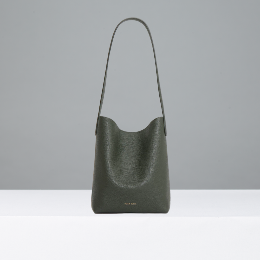 Seaweed leather handbag on a light gray background