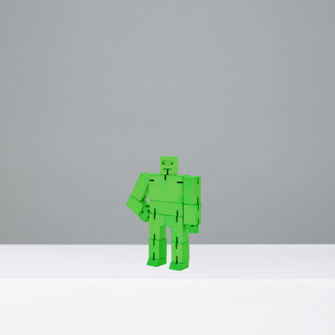 Green robot toy on a gray background