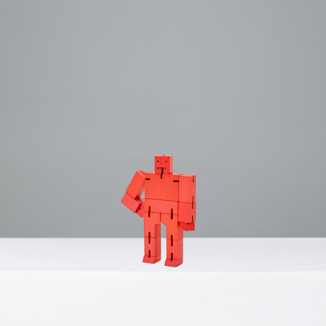 Red robot toy on a gray background