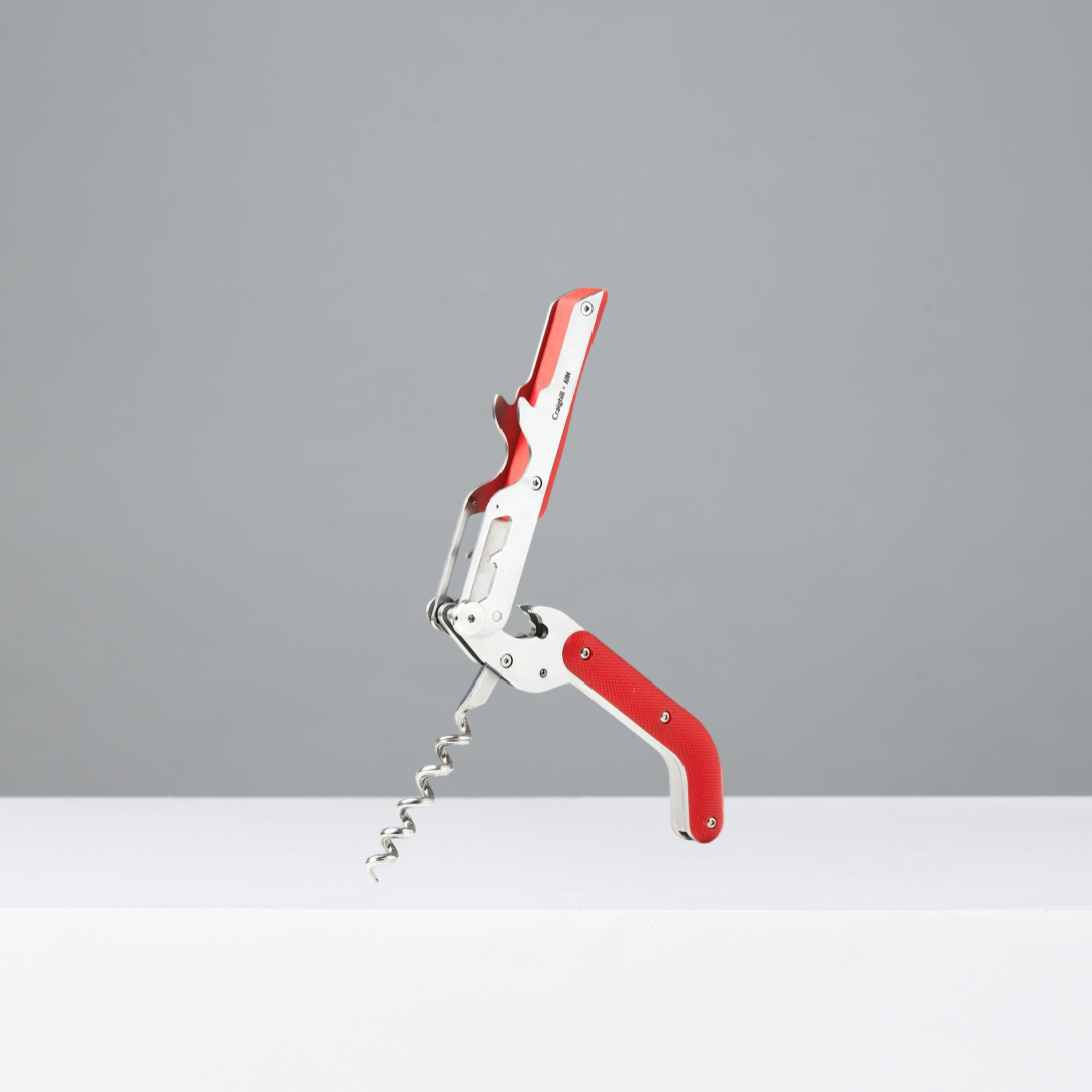 Red and silver corkscrew on a white background