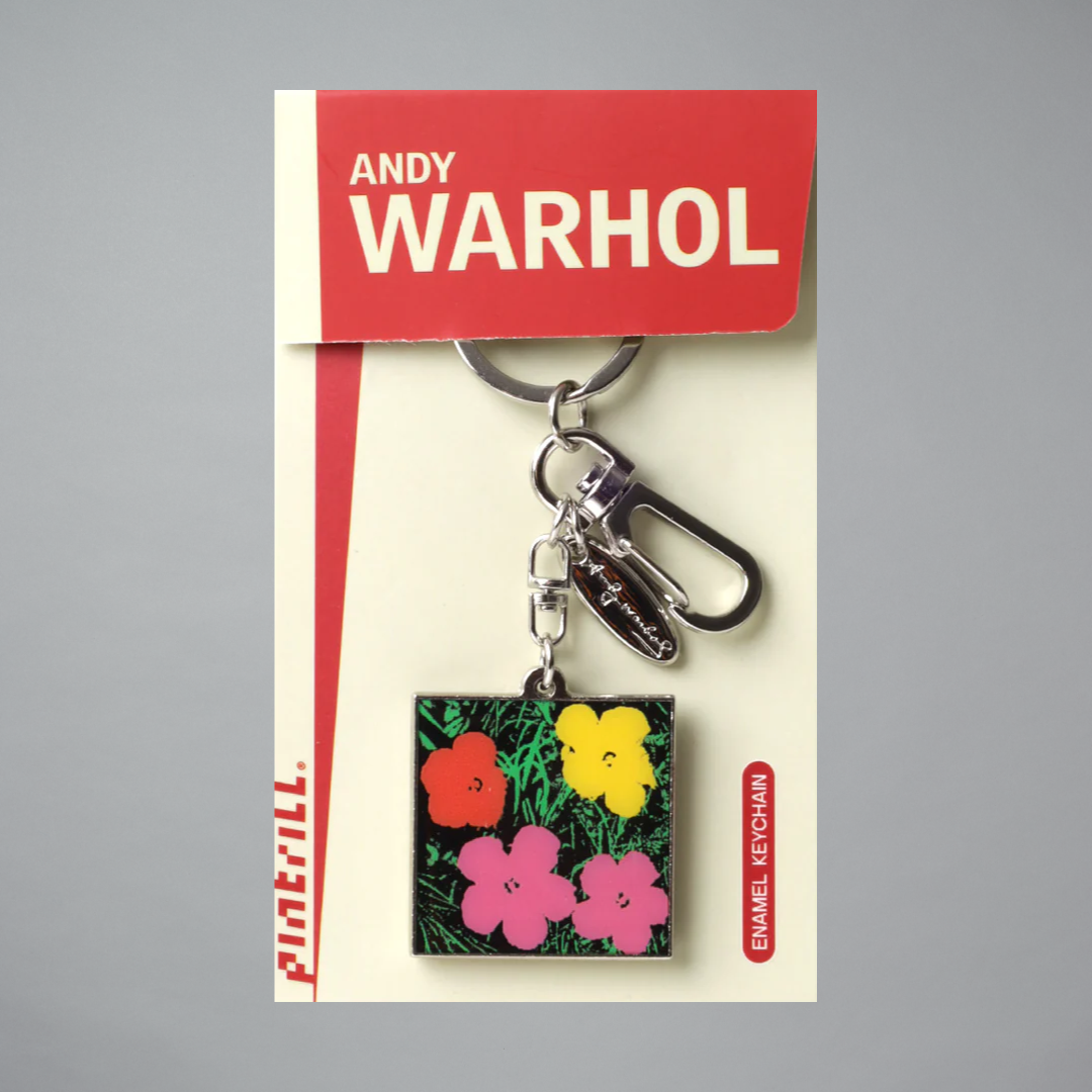 Andy Warhol Flowers keychain on Andy Warhol packaging on a gray background