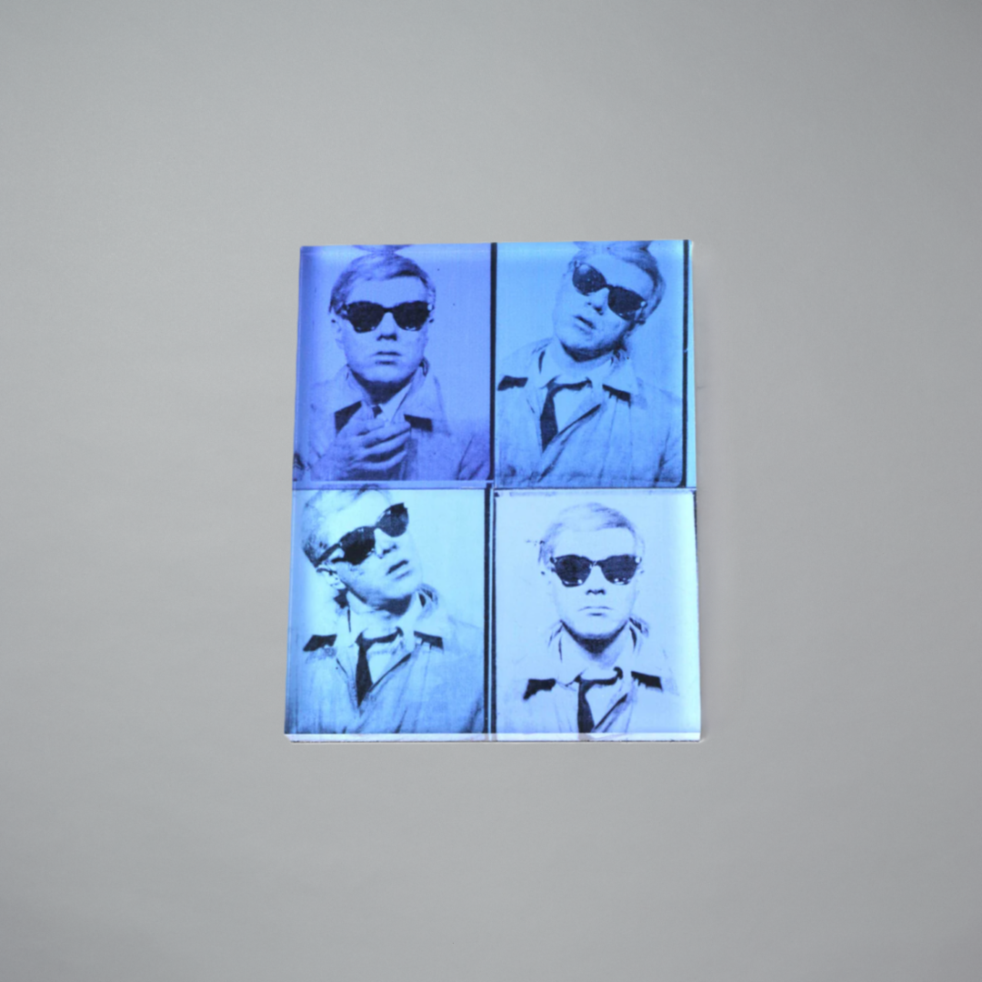 Andy Warhol Self-Portrait magnet on a gray background