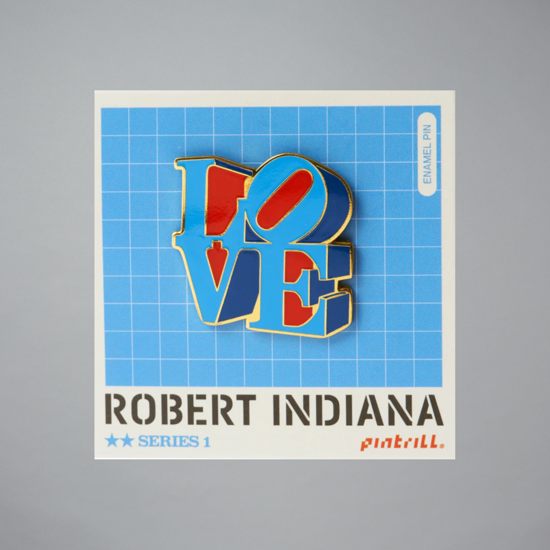 Robert Indiana Love pin on a gray background