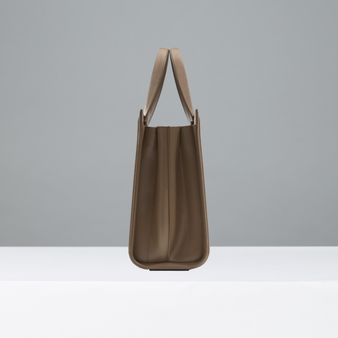 Camel handbag on a gray background