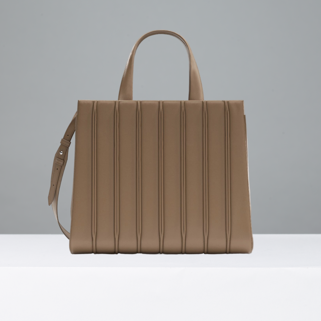 Camel handbag on a gray background