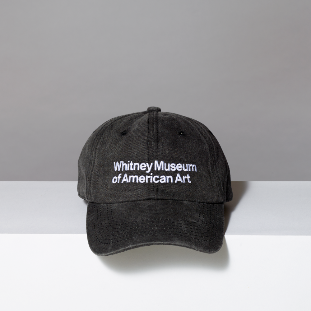 Acid wash black hat with Whitney Museum of American Art in white embroidery