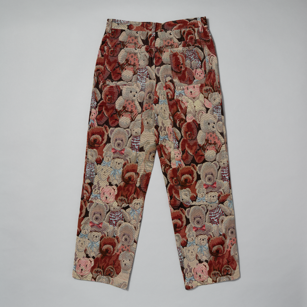 Trousers with teddy bear pattern on a gray background