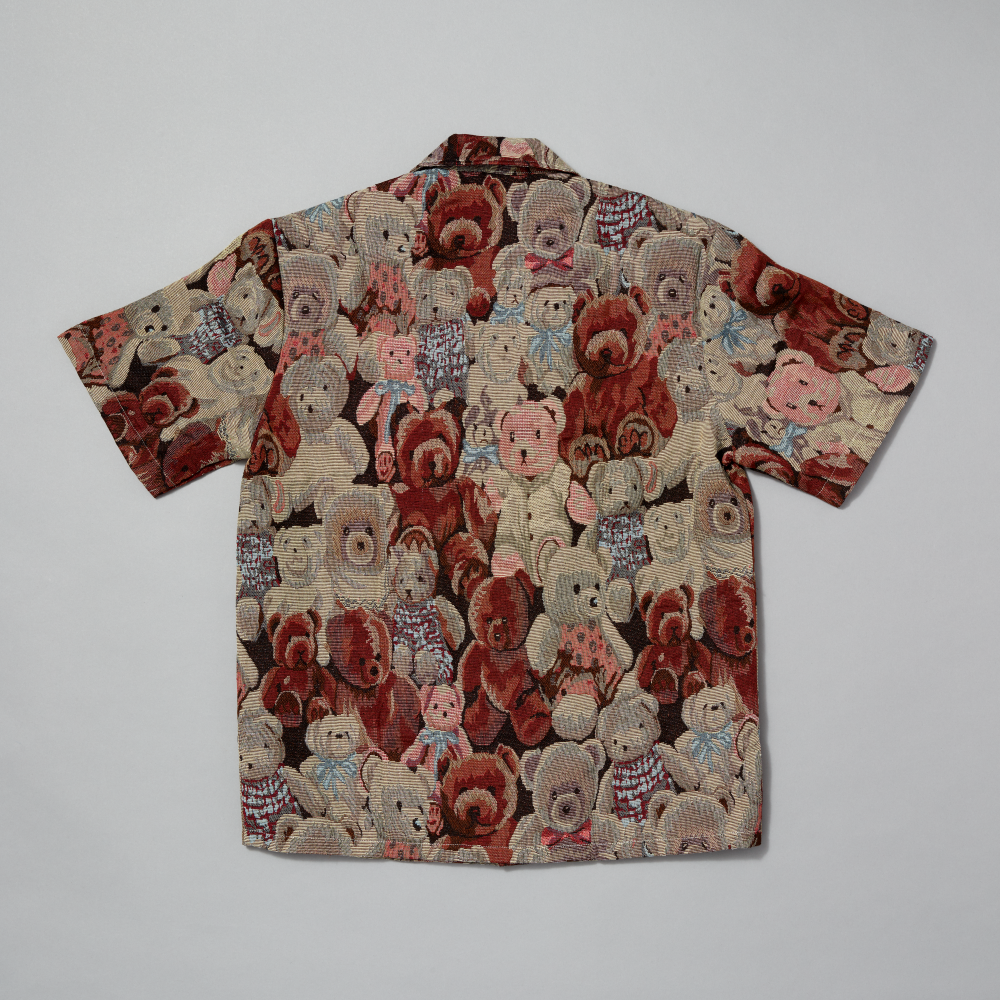 Shirt with teddy bear pattern on a gray background