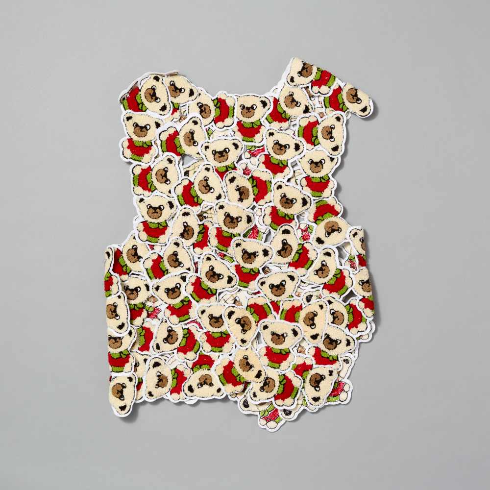Vest featuring bear patches on a gray background