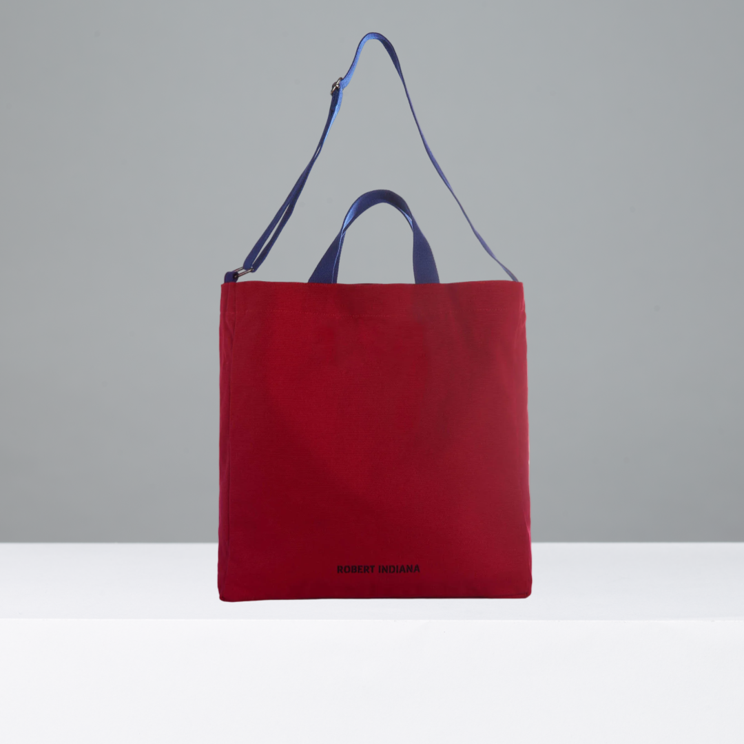 Red crossbody tote bag featuring Robert Indiana in black text