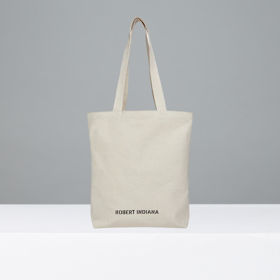 Beige tote bag featuring Robert Indiana in black text