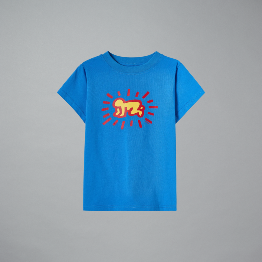 Blue t-shirt with a red and yellow graphic on a gray background